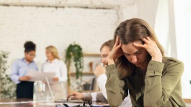 Female employee suffering workplace mental health